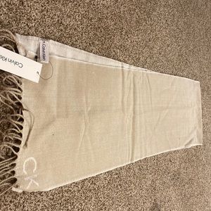 Calvin Klein scarf, tan/cream in color.